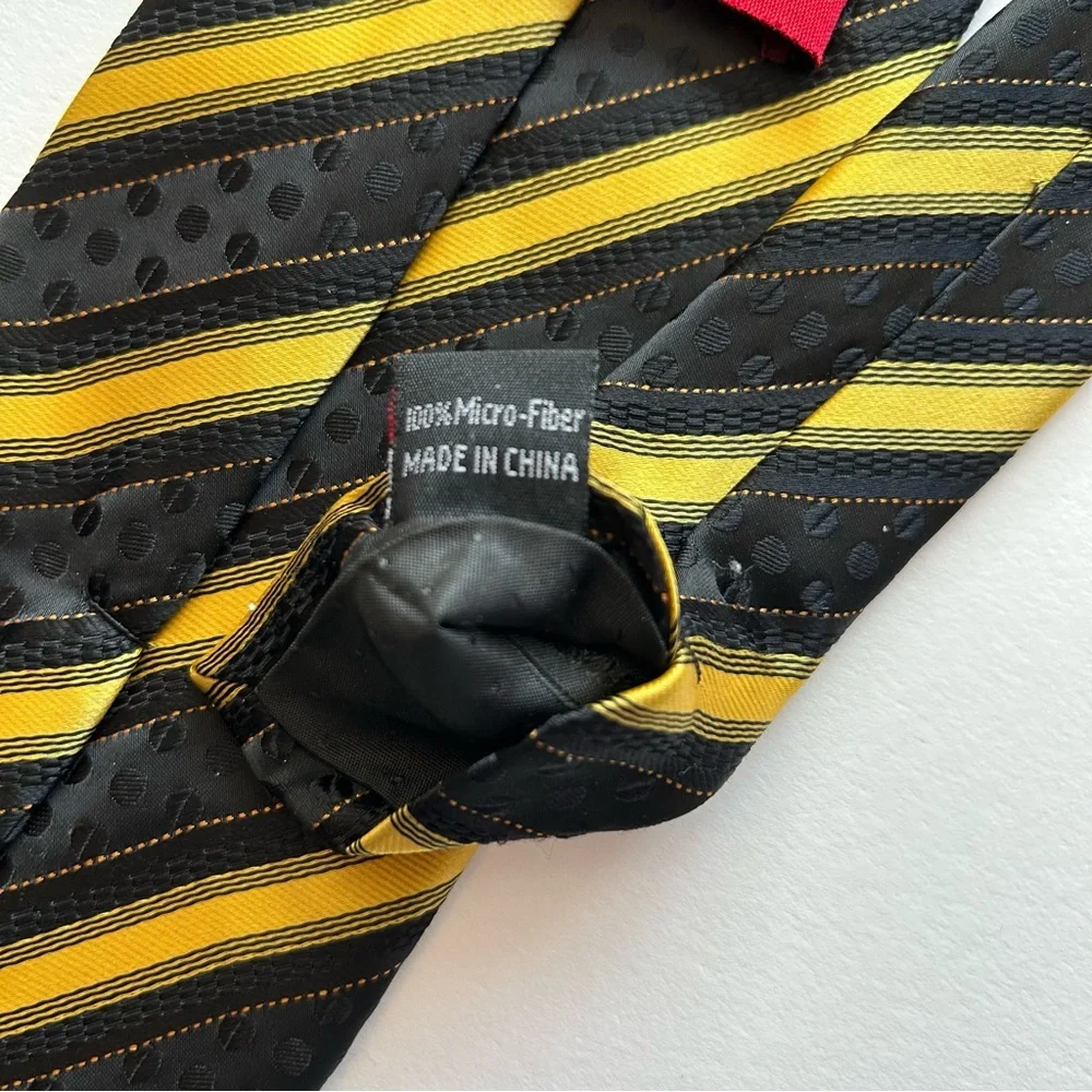 Striped black and gold men's dressy tie